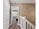 Hallway with carpet leading to a bedroom with plenty of natural light at 1046 Palisade Circle # 1046, Myrtle Beach, SC 29577