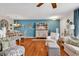 Comfortable living room featuring hardwood floors, a dining area, stylish furnishings, and coastal decorations at 1046 Palisade Circle # 1046, Myrtle Beach, SC 29577