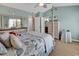 Relaxing primary bedroom with light blue walls and a four poster bed across from the bathroom at 1046 Palisade Circle # 1046, Myrtle Beach, SC 29577
