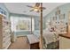 Relaxing primary bedroom with light blue walls and a four poster bed near a window at 1046 Palisade Circle # 1046, Myrtle Beach, SC 29577