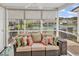 Inviting screened-in porch with comfortable seating and a view of the tranquil pond at 1046 Palisade Circle # 1046, Myrtle Beach, SC 29577