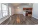 Bright dining area featuring wood floors, modern lighting, and an open floorplan connecting to the kitchen at 107 Carolines Cove Ct., Myrtle Beach, SC 29588