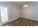 Cozy dining area with a modern chandelier, hardwood floors, and neutral paint at 107 Carolines Cove Ct., Myrtle Beach, SC 29588