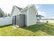 View of home exterior with gray siding, green lawn, and storage shed at 107 Carolines Cove Ct., Myrtle Beach, SC 29588