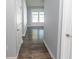Hallway with wood flooring, neutral paint, and light-filled view of the Living Room at 107 Carolines Cove Ct., Myrtle Beach, SC 29588
