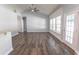 Bright living room with wood floors, vaulted ceiling, and an adjacent kitchen at 107 Carolines Cove Ct., Myrtle Beach, SC 29588