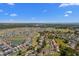 Aerial view of the community showcasing the homes, landscaping, and nearby lake and ocean at 1095 Plantation Dr. W # 29 N, Little River, SC 29566