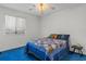 Cozy bedroom with a queen-sized bed, bright window, and soft carpet flooring at 1095 Plantation Dr. W # 29 N, Little River, SC 29566