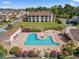 Overhead shot of a community pool with a hot tub and plenty of deck space at 1095 Plantation Dr. W # 29 N, Little River, SC 29566