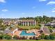 Aerial view of community pool area with ample seating and well-maintained landscaping at 1095 Plantation Dr. W # 29 N, Little River, SC 29566
