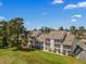 Exterior view of condo buildings with screened in patios and parking at 1095 Plantation Dr. W # 29 N, Little River, SC 29566
