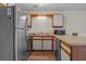 Efficient kitchen featuring stainless steel appliances, light countertops, and wooden-accented cabinetry at 1095 Plantation Dr. W # 29 N, Little River, SC 29566