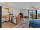 Open-concept living room with kitchen, stainless steel appliances, and access to an outdoor patio at 1095 Plantation Dr. W # 29 N, Little River, SC 29566