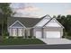 Charming home boasts a two-car garage, manicured lawn, and inviting curb appeal at 124 Northbrook Dr, Murrells Inlet, SC 29576