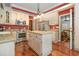Spacious kitchen with stainless steel appliances, center island, granite counter tops, and hardwood floors at 124 Windmeadows Dr., Conway, SC 29526