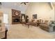 Open-concept living room featuring a brick fireplace, plush seating, and vaulted ceilings at 124 Windmeadows Dr., Conway, SC 29526