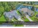 Stunning aerial view of a house with a pond and a well-maintained lawn at 1249 Trent Dr., Murrells Inlet, SC 29576