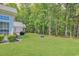 A lush green backyard with trees and ample space for outdoor activities at 1249 Trent Dr., Murrells Inlet, SC 29576