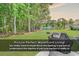Beautiful backyard featuring a spacious lawn, trees, and waterfront views at 1249 Trent Dr., Murrells Inlet, SC 29576