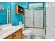 This well-lit bathroom features a shower with sliding glass doors and a stylish vanity at 1249 Trent Dr., Murrells Inlet, SC 29576