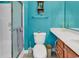 Cozy turquoise bathroom featuring a toilet, vanity and shower at 1249 Trent Dr., Murrells Inlet, SC 29576