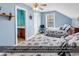This blue bedroom features two beds, a ceiling fan and an ensuite bathroom at 1249 Trent Dr., Murrells Inlet, SC 29576