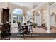Elegant dining room with large windows and a classic chandelier at 1249 Trent Dr., Murrells Inlet, SC 29576