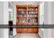 Hallway featuring custom built-in shelving and wood flooring at 1249 Trent Dr., Murrells Inlet, SC 29576