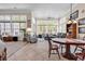 Cozy living room with tile flooring and large windows offering views of the surrounding trees at 1249 Trent Dr., Murrells Inlet, SC 29576