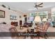 Bright living room with 12 foot ceilings and a ceiling fan, showing natural light from large windows at 1249 Trent Dr., Murrells Inlet, SC 29576