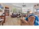 Comfortable living room showcasing wood-look tile floors, a ceiling fan, and views of the outside at 1249 Trent Dr., Murrells Inlet, SC 29576