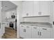 Spacious kitchen with generous counter space, stainless appliances, and white shaker cabinets at 135 Stonewall Circle # 7-2, Longs, SC 29568