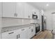 Modern kitchen features stainless steel appliances, granite countertops, and classic white subway tile backsplash at 135 Stonewall Circle # 7-2, Longs, SC 29568
