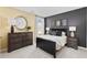 Cozy bedroom with dark wood furniture and a modern aesthetic at 135 Warner Crossing Way, Loris, SC 29569