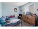 Cozy bedroom with light blue walls, large window, and dresser with storage at 1411 Turkey Ridge Rd. # 30-B, Surfside Beach, SC 29575