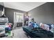 This bedroom features grey walls, a window, and casual decor at 1411 Turkey Ridge Rd. # 30-B, Surfside Beach, SC 29575