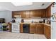 Well-lit kitchen featuring wooden cabinetry, tile backsplash, and essential appliances at 1411 Turkey Ridge Rd. # 30-B, Surfside Beach, SC 29575