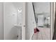Bright powder room featuring a pedestal sink, mirror, and tiled flooring at 1411 Turkey Ridge Rd. # 30-B, Surfside Beach, SC 29575