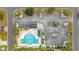 Aerial view of community pool with surrounding lounge area, tables, and parking at 1512 Virginia Pine Dr., Longs, SC 29568
