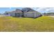 Grassy backyard featuring a screened-in porch, ideal for outdoor activities and enjoyment at 1512 Virginia Pine Dr., Longs, SC 29568