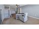 Bright bedroom with a ceiling fan, desk area, comfortable chair and loft-style bed at 1512 Virginia Pine Dr., Longs, SC 29568