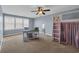 Spacious bedroom featuring a ceiling fan, desk area, and a unique loft-style bed at 1512 Virginia Pine Dr., Longs, SC 29568
