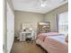 Bright bedroom featuring a vanity with lighted mirror and a television on a shelf at 1512 Virginia Pine Dr., Longs, SC 29568