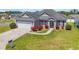 Charming single-story home with a manicured lawn, flower beds and an attached two-car garage at 1512 Virginia Pine Dr., Longs, SC 29568