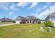 Charming one-story home featuring a well-manicured lawn and colorful flower beds enhancing its curb appeal at 1512 Virginia Pine Dr., Longs, SC 29568