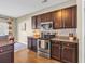 Modern kitchen with stainless steel appliances, granite countertops and stylish cabinetry at 1512 Virginia Pine Dr., Longs, SC 29568