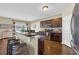 Spacious kitchen with stainless steel appliances, granite countertops and breakfast bar seating at 1512 Virginia Pine Dr., Longs, SC 29568