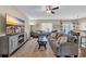 Cozy living room featuring a large television and direct access to dining area and outdoor patio at 1512 Virginia Pine Dr., Longs, SC 29568