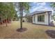 A view of this home's beautiful backyard showing the covered patio at 1559 Old Tram Rd., Little River, SC 29566