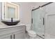 Bathroom with a vanity, vessel sink, framed mirror, and a glass enclosed shower at 1559 Old Tram Rd., Little River, SC 29566